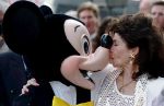 HOLLYWOOD, FL - SEPTEMBER 14:  Annette Funicello (R) kisses Mickey Mouse 14 September 1993 after she received a star on the famous Hollywood Walk of Fame in California. The U.S. actress and singer is best known as a famous mouseketeer on the popular 1960's television show, "The Mickey Mouse Club" as well as the beach movies she made with Frankie Avalon.  (Photo credit should read VINCE BUCCI/AFP/Getty Images)