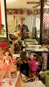 This is actually Cowboy Mickey in the middle of the bedroom he shares with about 500 dolls and action figures, 1000 books, and the fairy in the foreground who is real.